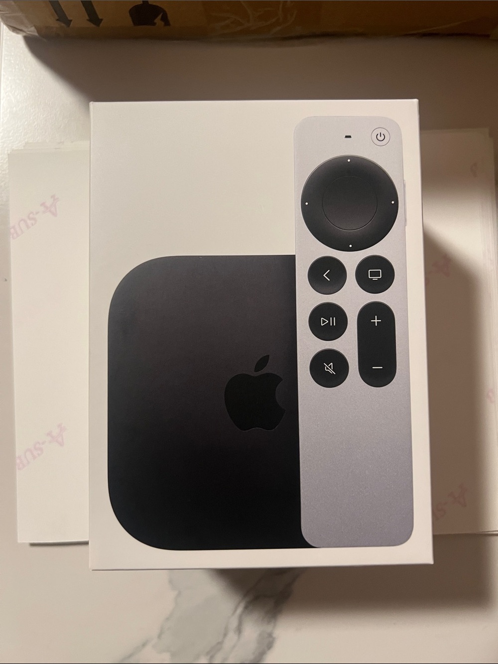 Apple TV and Silver Siri Remote | Black Apple Unit